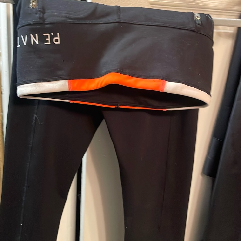 P.E nation black legging orange white around waist. No tag medium